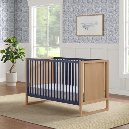 11 Best Cribs Of 2024 Milk Drunk   Emery Crib In Natural And Navy With Natural Guardrail Lifestyle 450x450 